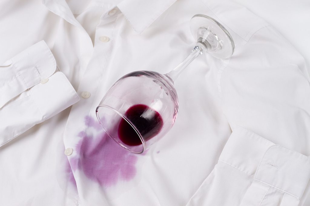 Wine pouring on white shirt